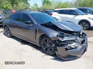 2021 Acura TLX w/A-Spec Package z VIN 19UUB6F52MA000424, wystawiony jako IAAI lot #42075033 z przebiegiem 53 996 mil mil oraz . Historia ofert i sprzedaży dostępna na DreamBid. Obrazek 1.