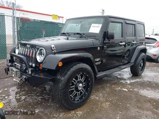 2011 Jeep Wrangler Unlimited Sahara with VIN 1J4BA5H12BL548870, listed as a IAAI auction lot 42010303 with 139,693 mi miles. Bid and sale history available at carsss.com. Image 17.
