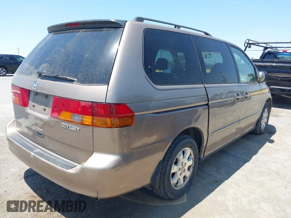 2003 Honda Odyssey EX-L with VIN 5FNRL18993B127164, listed as a IAAI auction lot 42474080 with 152,838 mi miles and . Bid and sale history available at DreamBid. Image 4.