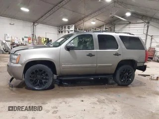 2009 Chevrolet Tahoe LTZ with VIN 1GNFK33049R143390, listed as a IAAI auction lot 41747041 with 209,492 mi miles and . Bid and sale history available at DreamBid. Image 14.