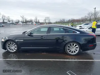2011 Jaguar XJ with VIN SAJWA1CB8BLV12389, listed as a IAAI auction lot 41957217 with 51,585 mi miles. Bid and sale history available at carsss.com. Image 14.