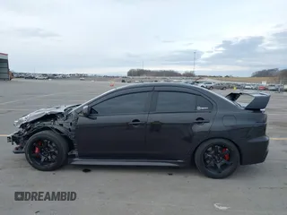 2013 Mitsubishi Lancer Evolution GSR with VIN JA32W8FV8DU012080, listed as a IAAI auction lot 41379744 with 95,070 mi miles. Bid and sale history available at carsss.com. Image 15.