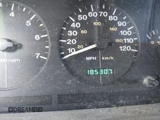 1997 Jeep Grand Cherokee Laredo with VIN 1J4GZ58S0VC550242, listed as a IAAI auction lot 41032114 with 185,307 mi miles. Bid and sale history available at carsss.com. Image 7.