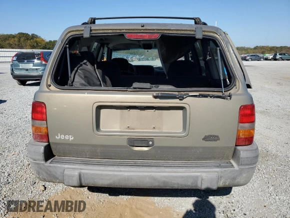 1998 Jeep Grand Cherokee Laredo with VIN 1J4GZ58S5WC165213, listed as a Copart auction lot 77611434 with 168,688 mi miles and Salvage Title. Bid and sale history available at carsss.com. Image 6.
