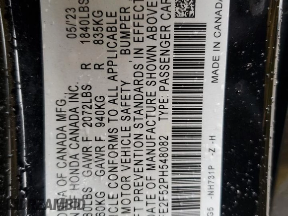 2023 Honda Civic Sport with VIN 2HGFE2F52PH548082, listed as a Copart auction lot 57226055 with 33,155 mi miles and Salvage title. Bid and sale history available at DreamBid. Image 12.