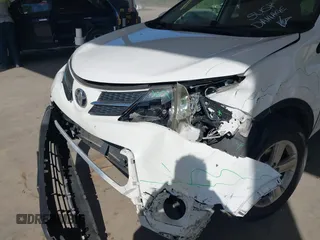 2014 Toyota RAV4 XLE with VIN JTMRFREV6EJ002755, listed as a IAAI auction lot 42021556 with 133,570 mi miles. Bid and sale history available at carsss.com. Image 6.