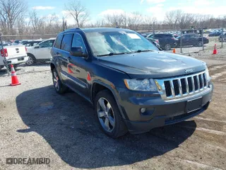 2011 Jeep Grand Cherokee Laredo with VIN 1J4RR4GT0BC543283, listed as a IAAI auction lot 41890109 with 123,325 mi miles. Bid and sale history available at carsss.com. Image 1.