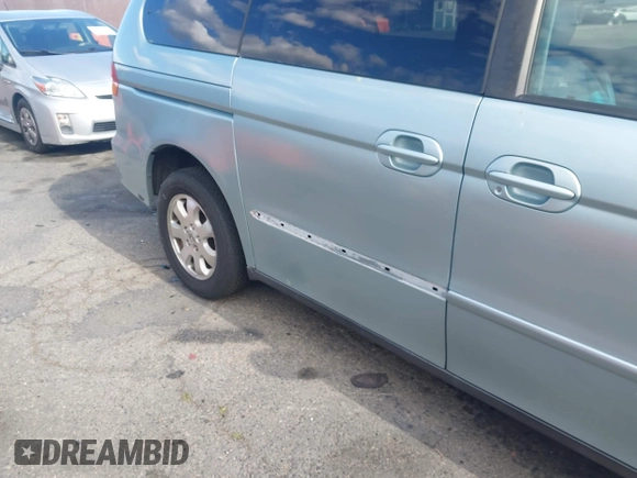 2003 Honda Odyssey EX-L with VIN 5FNRL18923B071598, listed as a IAAI auction lot 41947046 with 224,394 mi miles and . Bid and sale history available at DreamBid. Image 13.