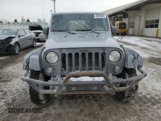 2015 Jeep Wrangler Unlimited Willys Wheeler with VIN 1C4BJWDG9FL516493, listed as a Copart auction lot 45098345 with 152,009 mi miles and Salvage Title. Bid and sale history available at DreamBid. Image 5.