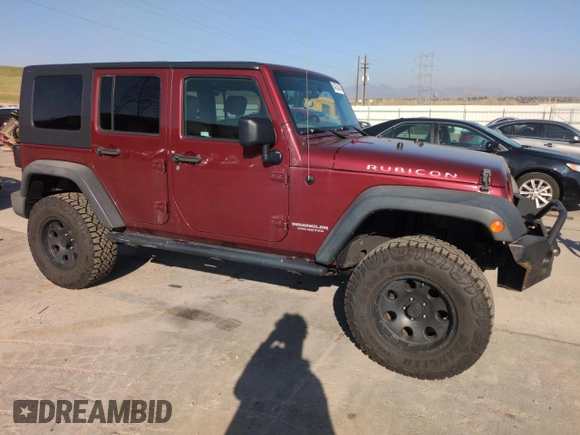 2010 Jeep Wrangler Unlimited Rubicon with VIN 1J4BA6H13AL140902, listed as a Copart auction lot 54335455 with 118,423 mi miles and Clean title. Bid and sale history available at DreamBid. Image 4.
