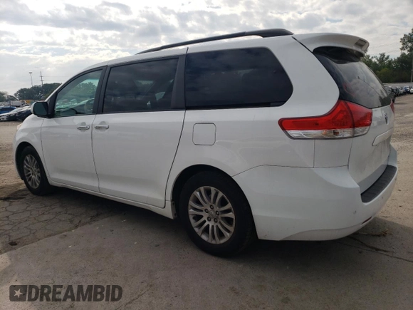 2012 Toyota Sienna XLE AAS with VIN 5TDYK3DC0CS250830, listed as a Copart auction lot 73323284 with 147,580 mi miles and Salvage Title. Bid and sale history available at DreamBid. Image 2.