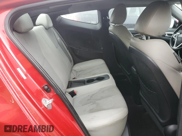 2013 Hyundai Veloster w/Gray Int z VIN KMHTC6AD0DU147454, wystawiony jako Copart lot #57814285 z przebiegiem 91 000 mil mil oraz Szkoda całkowita • Salvage title. Historia ofert i sprzedaży dostępna na DreamBid. Obrazek 10.