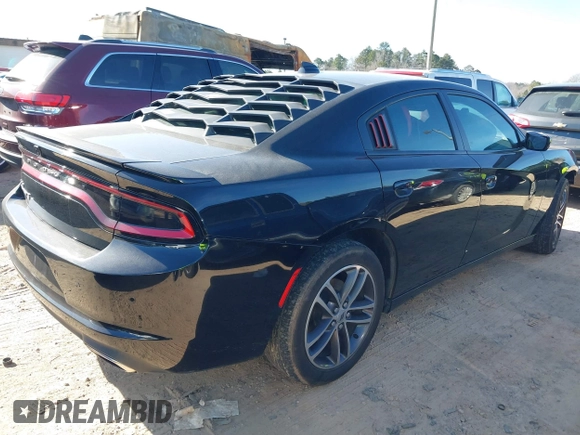 2019 Dodge Charger SXT with VIN 2C3CDXJG4KH710673, listed as a IAAI auction lot 41469797 with 102,011 mi miles and . Bid and sale history available at DreamBid. Image 4.