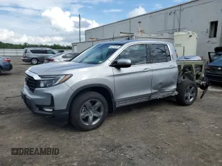 2023 Honda Ridgeline RTL-E with VIN 5FPYK3F70PB018858, listed as a Copart auction lot 64210205 with 16,562 mi miles and Salvage title. Bid and sale history available at DreamBid. Image 1.