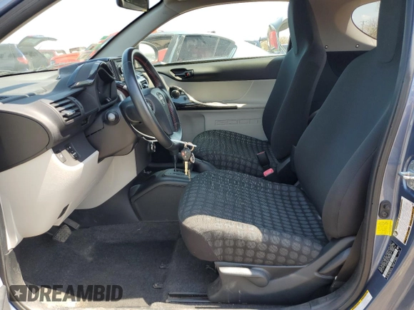 2012 Scion iQ z VIN JTNJJXB07CJ018481, wystawiony jako Copart lot #54014265 z przebiegiem 54 331 mil mil oraz Szkoda całkowita • Salvage title. Historia ofert i sprzedaży dostępna na DreamBid. Obrazek 7.