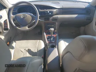 1999 Mazda Millenia z VIN JM1TA2217X1502746, wystawiony jako Copart lot #72165894 z przebiegiem 196 957 mil mil oraz Szkody całkowita. Historia ofert i sprzedaży dostępna na DreamBid. Obrazek 8.