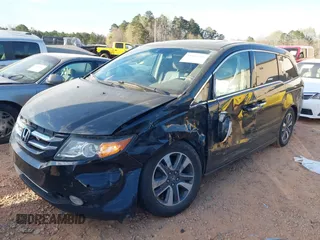 2014 Honda Odyssey Touring with VIN 5FNRL5H90EB077054, listed as a IAAI auction lot 41904456 with 197,869 mi miles and . Bid and sale history available at carsss.com. Image 2.