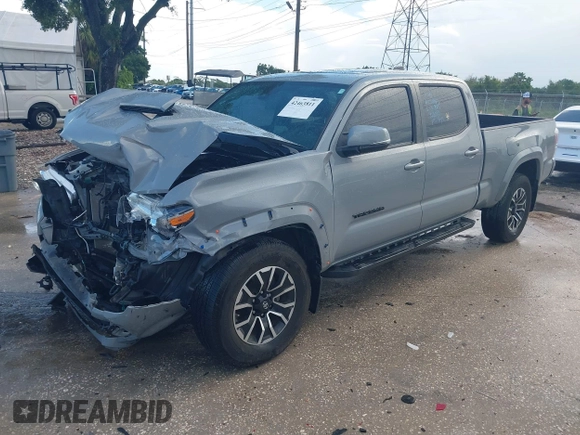 2020 Toyota Tacoma SR5 with VIN 3TMDZ5BN3LM080702, listed as a IAAI auction lot 42463811 with 70,185 mi miles and . Bid and sale history available at DreamBid. Image 2.