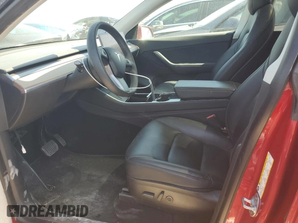 2021 Tesla Model Y Standard Range with VIN 5YJYGDED5MF116562, listed as a Copart auction lot 51211535 with 68,549 mi miles and Salvage Title. Bid and sale history available at DreamBid. Image 7.