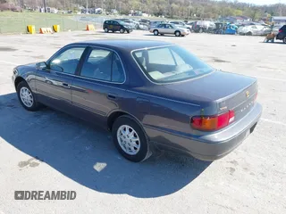1996 Toyota Camry DX with VIN 4T1BG12K8TU915891, listed as a IAAI auction lot 41874731 with 57,564 mi miles. Bid and sale history available at carsss.com. Image 3.