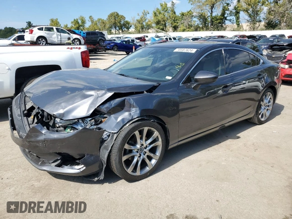 2014 Mazda 6 i Grand Touring с VIN JM1GJ1W67E1135264, выставлен на аукционе Copart как лот 70587624 с пробегом 86 926 миль миль и Списание • Salvage title. История ставок и продаж доступна на DreamBid. Изображение 1.