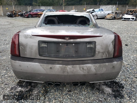 2004 Cadillac XLR z VIN 1G6YV34AX45601257, wystawiony jako Copart lot #44490755 z przebiegiem Nie podano mil oraz Szkody całkowita. Historia ofert i sprzedaży dostępna na DreamBid. Obrazek 6.