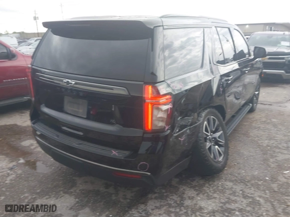 2021 Chevrolet Tahoe Z71 with VIN 1GNSKPKD5MR155986, listed as a IAAI auction lot 41870554 with 91,568 mi miles. Bid and sale history available at carsss.com. Image 4.