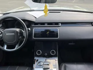 2018 Land Rover Range Rover Velar S z VIN SALYB2RX1JA778174, wystawiony jako Copart lot #59567875 z przebiegiem 74 406 mil mil oraz Czysty tytuł • Clean title. Historia ofert i sprzedaży dostępna na DreamBid. Obrazek 9.