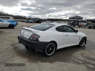 2003 Hyundai Tiburon z VIN KMHHM65D53U042971, wystawiony jako Copart lot #86919434 z przebiegiem 202 250 mil mil oraz Szkoda całkowita • Salvage title. Historia ofert i sprzedaży dostępna na DreamBid. Obrazek 3.