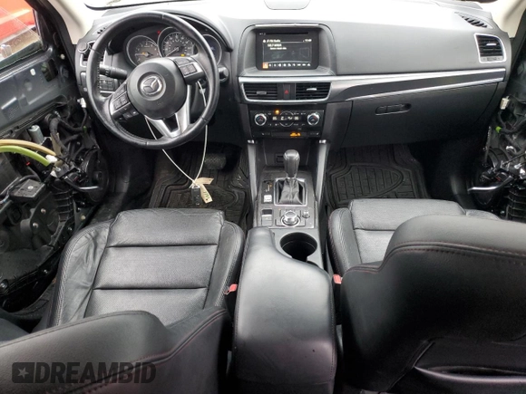 2016 Mazda CX-5 Grand Touring with VIN JM3KE4DY6G0834583, listed as a Copart auction lot 52015905 with 184,741 mi miles and Salvage Title. Bid and sale history available at DreamBid. Image 8.