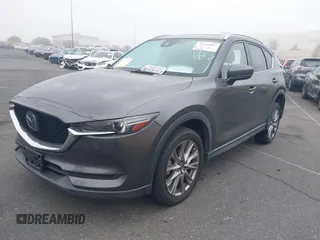 2021 Mazda CX-5 Grand Touring with VIN JM3KFADM2M1340669, listed as a IAAI auction lot 41916687 with 83,872 mi miles. Bid and sale history available at carsss.com. Image 2.