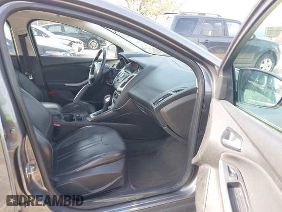 2013 Ford Focus SE with VIN 1FADP3F22DL117712, listed as a IAAI auction lot 42131439 with 124,327 mi miles. Bid and sale history available at carsss.com. Image 5.