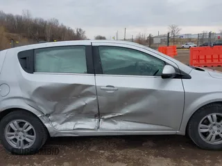 2016 Chevrolet Sonic LT with VIN 1G1JC6SH4G4151436, listed as a IAAI auction lot 41709048 with 121,121 mi miles. Bid and sale history available at carsss.com. Image 6.