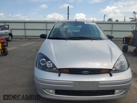 2001 Ford Focus ZX3 z VIN 3FAFP31341R244564, wystawiony jako Copart lot #55472105 z przebiegiem 168 296 mil mil oraz Szkoda całkowita • Salvage title. Historia ofert i sprzedaży dostępna na DreamBid. Obrazek 5.