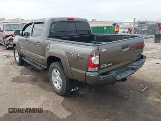 2013 Toyota Tacoma with VIN 3TMLU4EN6DM118537, listed as a IAAI auction lot 41824193 with 158,504 mi miles and . Bid and sale history available at DreamBid. Image 3.