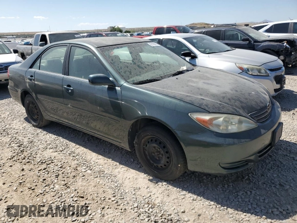2002 Toyota Camry LE z VIN JTDBE32K120068644, wystawiony jako Copart lot #61168915 z przebiegiem 210 149 mil mil oraz Czysty tytuł • Clean title. Historia ofert i sprzedaży dostępna na DreamBid. Obrazek 4.