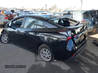 2021 Toyota Prius L Eco with VIN JTDKAMFU2M3134178, listed as a IAAI auction lot 41975477 with 26,936 mi miles. Bid and sale history available at carsss.com. Image 3.