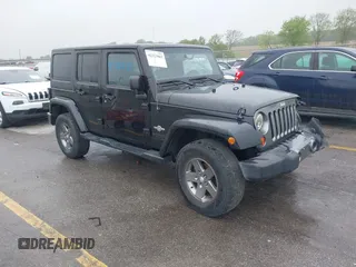 2013 Jeep Wrangler Unlimited Sport z VIN 1C4BJWDGXDL596450, wystawiony jako IAAI lot #42323862 z przebiegiem 114 105 mil mil oraz . Historia ofert i sprzedaży dostępna na DreamBid. Obrazek 1.