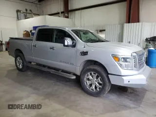 2016 Nissan Titan XD PRO-4X with VIN 1N6BA1F45GN506049, listed as a Copart auction lot 70746074 with 153,093 mi miles and Salvage Title. Bid and sale history available at carsss.com. Image 4.