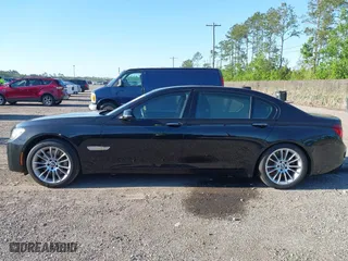 2015 BMW 7 Series 750Li with VIN WBAYE8C50FD781384, listed as a IAAI auction lot 42049829 with 128,087 mi miles. Bid and sale history available at carsss.com. Image 14.