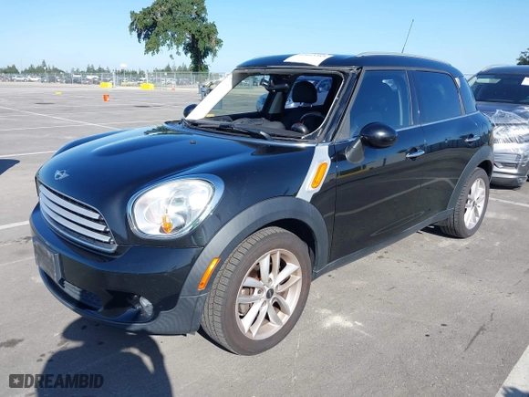2013 MINI Cooper Countryman with VIN WMWZB3C52DWM07621, listed as a IAAI auction lot 42085389 with 153,714 mi miles. Bid and sale history available at carsss.com. Image 2.