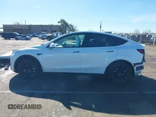 2023 Tesla Model Y Long Range with VIN 7SAYGDEE0PF945202, listed as a IAAI auction lot 41611762 with 7,316 mi miles and . Bid and sale history available at DreamBid. Image 14.