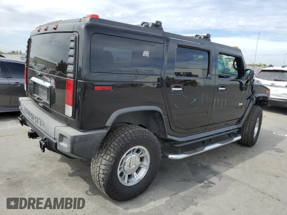 2005 Hummer H2 SUV with VIN 5GRGN23UX5H115383, listed as a Copart auction lot 71682984 with 157,405 mi miles and Salvage Title. Bid and sale history available at carsss.com. Image 3.
