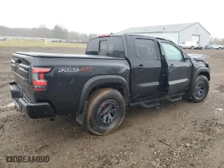 2025 Nissan Frontier PRO-4X with VIN 1N6ED1EK1SN606744, listed as a Copart auction lot 50168825 with 7,434 mi miles and Salvage Title. Bid and sale history available at carsss.com. Image 3.