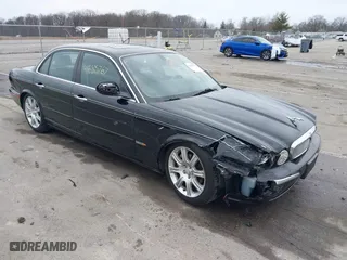 2004 Jaguar XJ with VIN SAJWA71C14SG20122, listed as a IAAI auction lot 41685767 with 113,392 mi miles. Bid and sale history available at carsss.com. Image 1.