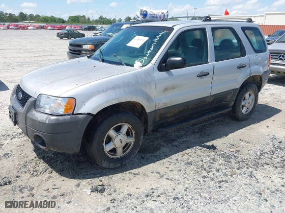 2003 Ford Escape XLS Popular with VIN 1FMYU02183KC05213, listed as a IAAI auction lot 41955134 with 305,524 mi miles. Bid and sale history available at carsss.com. Image 2.