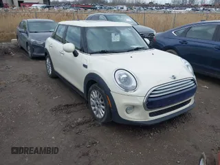 2015 MINI Hardtop 4 Door with VIN WMWXS5C58FT827875, listed as a IAAI auction lot 41716245 with 107,623 mi miles and . Bid and sale history available at DreamBid. Image 1.