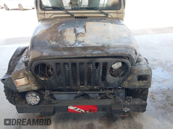 2003 Jeep Wrangler Sahara z VIN 1J4FA59S63P336928, wystawiony jako IAAI lot #42254314 z przebiegiem Nie podano mil oraz . Historia ofert i sprzedaży dostępna na DreamBid. Obrazek 6.