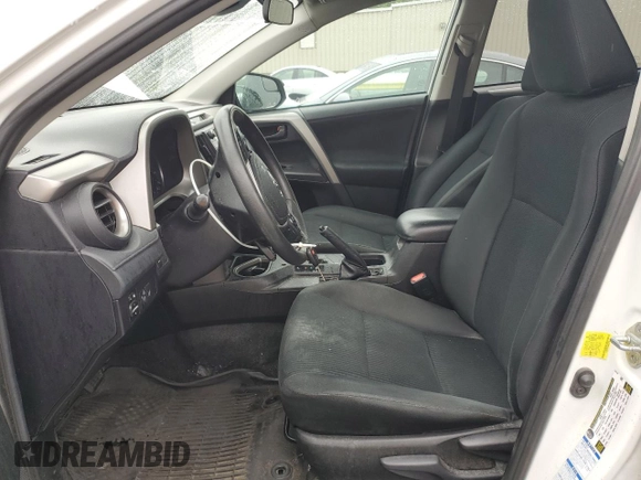 2018 Toyota RAV4 LE with VIN 2T3BFREV2JW853108, listed as a Copart auction lot 61245795 with 174,196 mi miles and Salvage title. Bid and sale history available at DreamBid. Image 7.