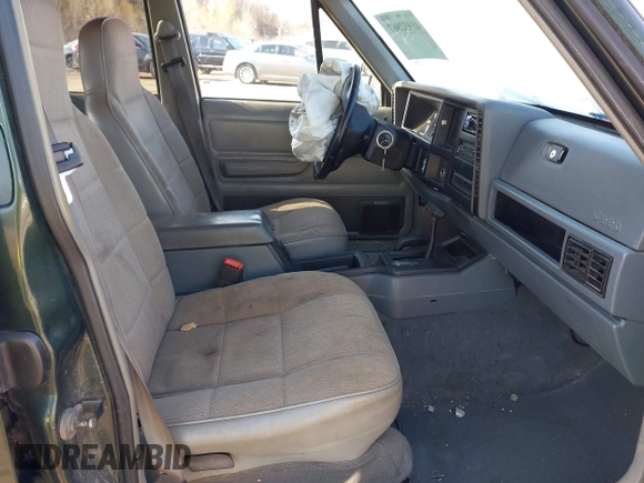 1996 Jeep Cherokee Sport with VIN 1J4FJ68S2TL299150, listed as a IAAI auction lot 41932867 with 142,761 mi miles. Bid and sale history available at carsss.com. Image 5.